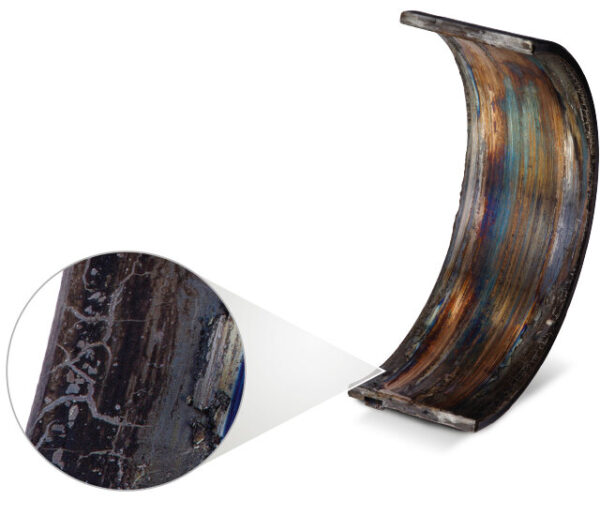 A seized and discolored bearing due to overheating